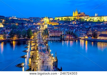 View Of Charles Bridge, Prague Castle And Vltava River In Prague, Czech Republic During Blue Hour.