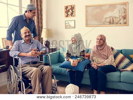 Muslim family relaxing in the home