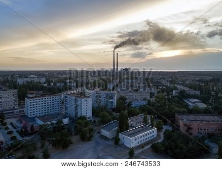 Aerial View Of Town, Nuclear Power Station, Thermal Power Station And Sky At Sunset. Aerial Photogra