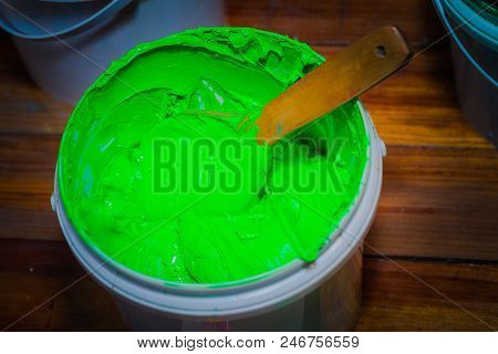 Light Green Color Of Plastisol Ink In White Plastic Barrel. Plastisol Ink Is Specially For Print On 