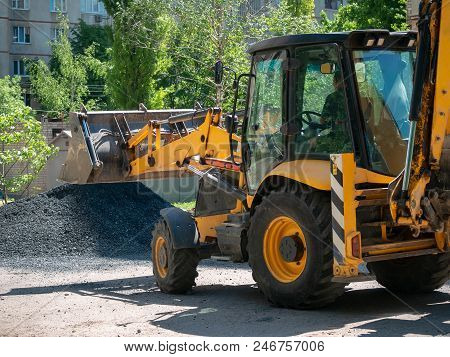 Buldozer Making And Constructing A New Asphalt Road Near The Civil Building. Concepts Of Improvement