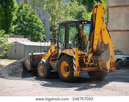 Buldozer Making And Constructing A New Asphalt Road Near The Civil Building. Concepts Of Improvement