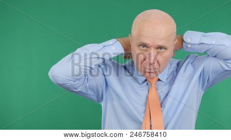 Presentable Businessman Arranging His Tie In Green Background