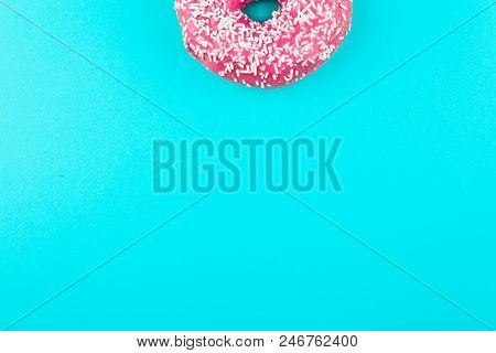 One Pink Isolated Donut On A Mint Background. Fashion Minimal.
