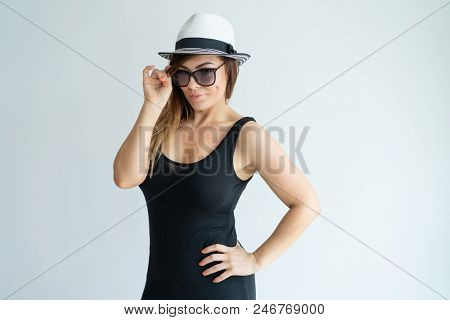 Confident Pretty Woman Adjusting Sunglasses. Lady Holding Hand On Hip And Looking At Camera. Summer 