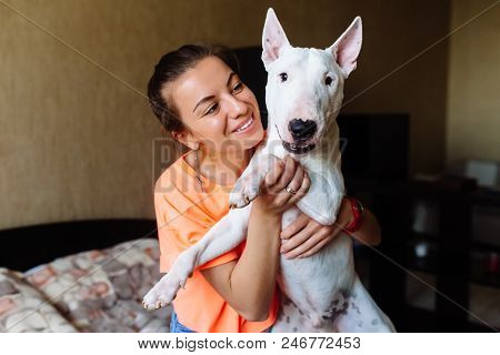 Cute Girl Petting Her Dog.beautiful Girl Having Fun With Her Dog And Enjoying Herself.girl And Her D