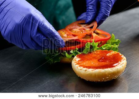 Chef In Sterile Gloves Prepares A Vegetarian Burger Close-up