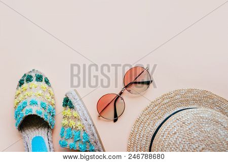 Summer Fashion Flatlay With Espadrille Sandals, Gradient Round Sunglasses And Straw Hat On The Beige