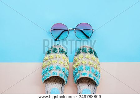 Summer Fashion Flatlay With Gradient Round Sunglasses And Espadrille Sandals On The Blue Background.