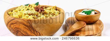 Indian Biryani With Chicken, Yogurt And Spices In A Plate On A Wooden Table. New Year's, Christmas D