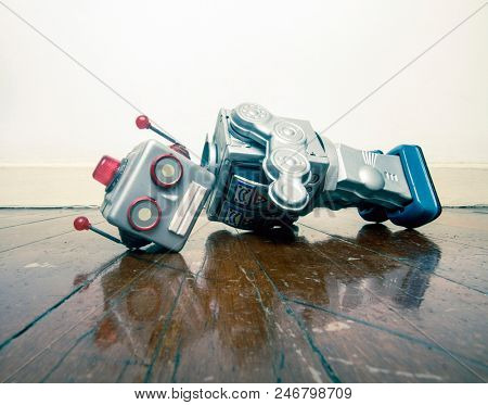 vintage bot lost his head on a old wooden floor with reflection 