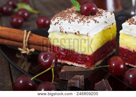 Cherry And Vanilla Layer Cake On Black Plate. Homemade Cherry Cake, Rustic Style.
