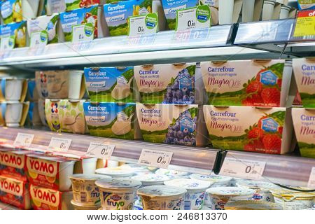 MILAN, ITALY - CIRCA NOVEMBER, 2017: assortment of yogurt on display for sale at Carrefour Express in Milan.