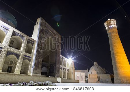 Night Photo Shoot Of Ancient Buildings In The Old Town Of Bukhara, Central Asia. Kalyan Minaret Of P