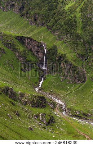Waterfall in the beautiful green valley seen from Rohtang pass, Himachal Pradesh, India
