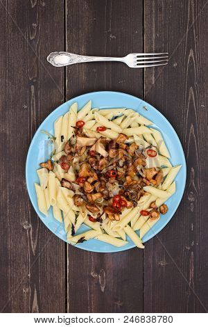 Vegetarian Meal With Forest Mushrooms. Pasta Penne With Golden Chanterelle Mushrooms In Blue Plate O