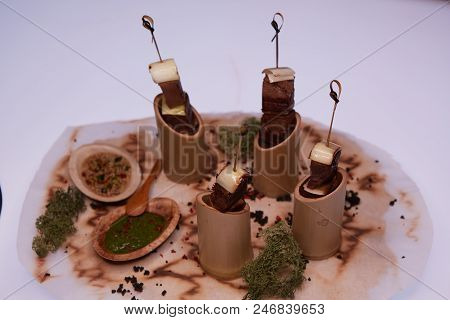 Grilled Pork Meat With Sauce Inserted With Bamboo Sticks. Shallow Dof.