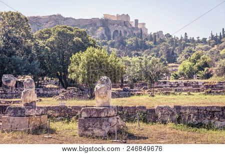 Ruined Statues On The Agora Overlooking Famous Acropolis, Athens, Greece. Panoramic Scenic View Of T