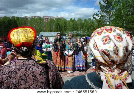 Russia, Koltsovo - June 03, 2018: People in national russian dresses during Folklore Festival 