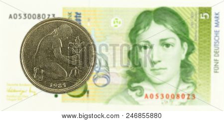50 German Pfennig Coin Agains 5 German Mark Bank Note