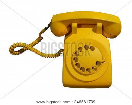 Retro And Vintage Yellow Rotary Phone Isolated On White Background With Clipping Path