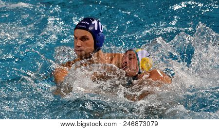 Budapest, Hungary - Jul 17, 2017. VARGA Denes (HUN) waterpolo player (in blue) fights with GILCHRIST Jarrod (AUS). FINA Waterpolo World Championship was held in Alfred Hajos Swimming Centre.