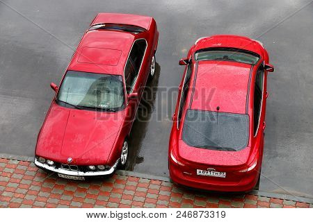 Novyy Urengoy, Russia - June 13, 2018: Red Motor Cars Bmw (e34) 5-series And Ford Focus In The City 