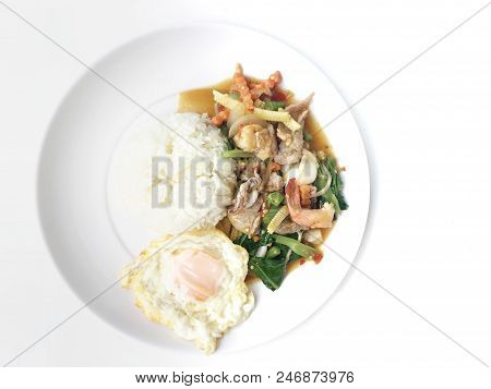 Vegetable Stir-fry Dishes With Spicy  Seafood With Basil Leaves And Mixed Vegetable And Fried Egg On