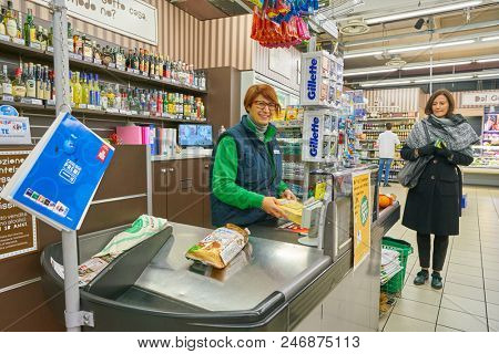 MILAN, ITALY - CIRCA NOVEMBER, 2017: cashier at Carrefour Express in Milan.