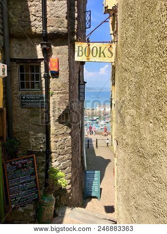 Tenby, Uk: June 10, 2018: Quaint Book Shop In An Alleyway In The Back Streets Of Tenby, An Old Fishi
