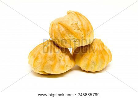 Heap Of Three Tasty Profiteroles Isolated On The White Background.