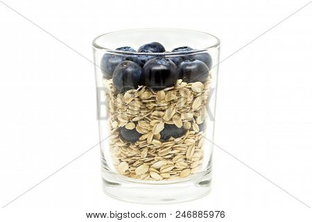 Health Concept. Diet Dessert With Oatmeal And Fresh Berries In The Glass On The White Background.
