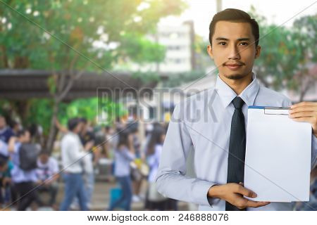 This Career Saleman Or Business Man Inspection Writing On Notepad Or 
Book, Paper With Building And 