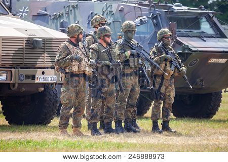 Feldkirchen / Germany - June 9, 2018: German Soldiers Stands Near Military Vehicles On A Open Day On