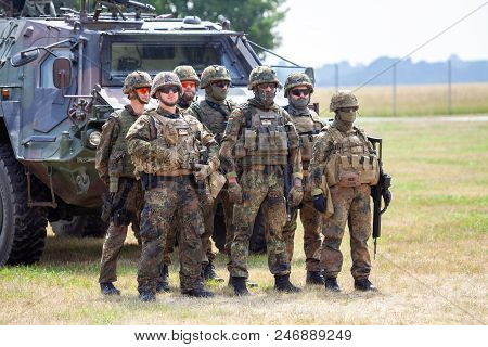 Feldkirchen / Germany - June 9, 2018: German Soldiers Stands Near Military Vehicles On A Open Day On