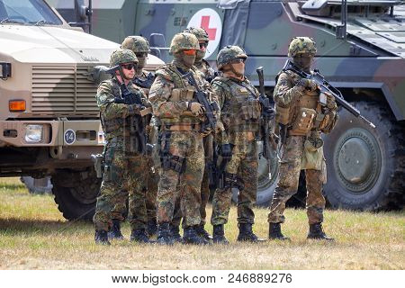 Feldkirchen / Germany - June 9, 2018: German Soldiers Stands Near Military Vehicles On A Open Day On