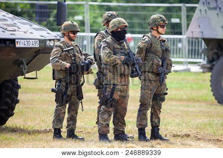 Feldkirchen / Germany - June 9, 2018: German Soldiers Stands Near Military Vehicles On A Open Day On