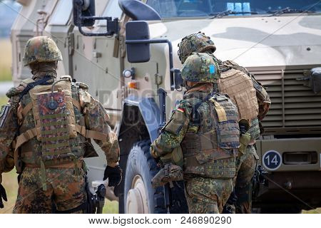 German Soldiers Stands Near Military Vehicles On A Open Day On Day Of The Bundeswehr In Feldkirchen
