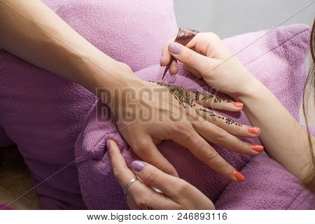 Drawing Process Of Henna Menhdi Ornament On Woman's Hand. Beauty Concept