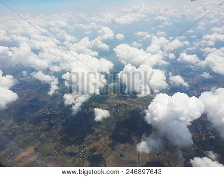 Blue Sky With White Clouds And Land View.