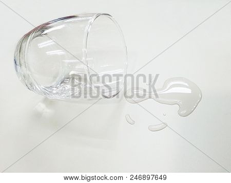 Water Glass Fall Down On The Table.