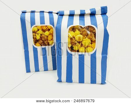 Sweet Popcorn In The Bag On White Background.