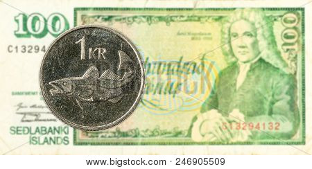 1 Icelandic Krona Coin Against 100 Icelandic Krona Bank Note