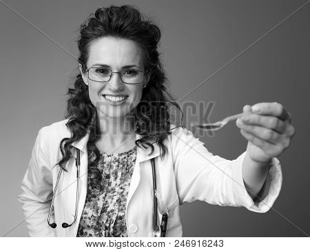 Paediatrist Woman Giving Spoon Of Children's Suspension On