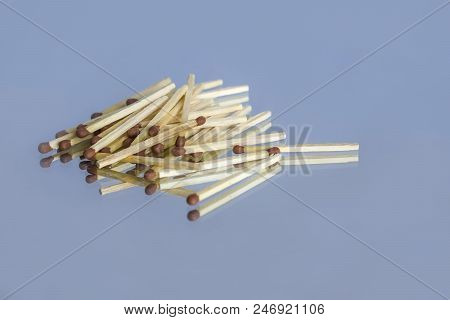 Wooden Matches With A Sulfur Head In Bulk And Their Reflection On The Mirror Surface, On An Isolated