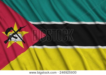 Mozambique Flag  Is Depicted On A Sports Cloth Fabric With Many Folds. Sport Team Waving Banner