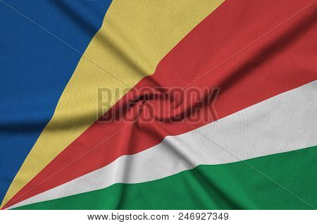 Seychelles Flag  Is Depicted On A Sports Cloth Fabric With Many Folds. Sport Team Waving Banner