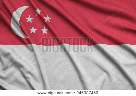 Singapore Flag  Is Depicted On A Sports Cloth Fabric With Many Folds. Sport Team Waving Banner