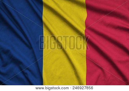 Chad Flag  Is Depicted On A Sports Cloth Fabric With Many Folds. Sport Team Waving Banner