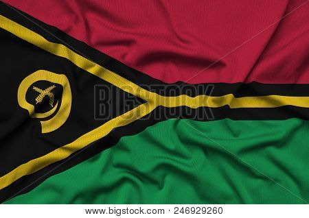 Vanuatu Flag  Is Depicted On A Sports Cloth Fabric With Many Folds. Sport Team Waving Banner